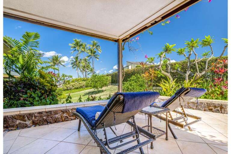 Patio View With Loungers, Lush Landscape, Under Vivid Skies