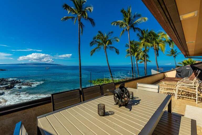 Seaside Balcony View With Swaying Palms Poised By Pristine Waters
