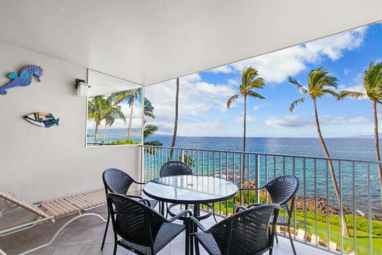 Balcony View Of Blue Sea And Palm Trees