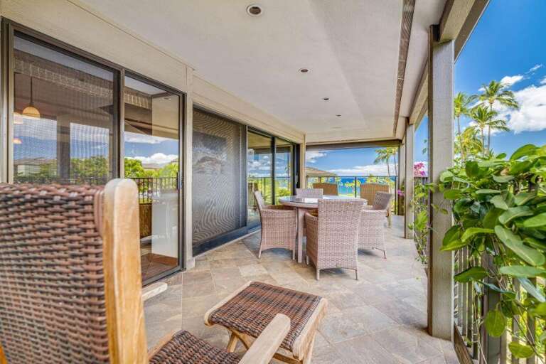 Balcony View With Breezy Blue Sky, Lush Leaves, And Laid-back Seating