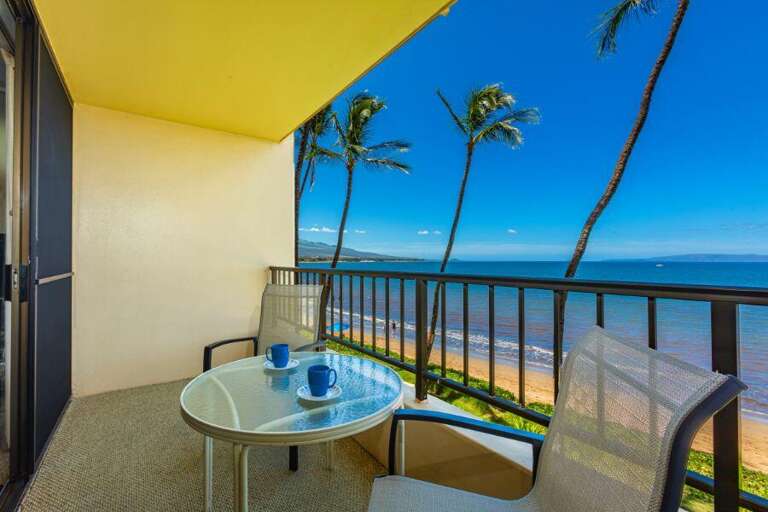 Balcony View Of Beach With Palms And Sea Breeze At Vacation Rental