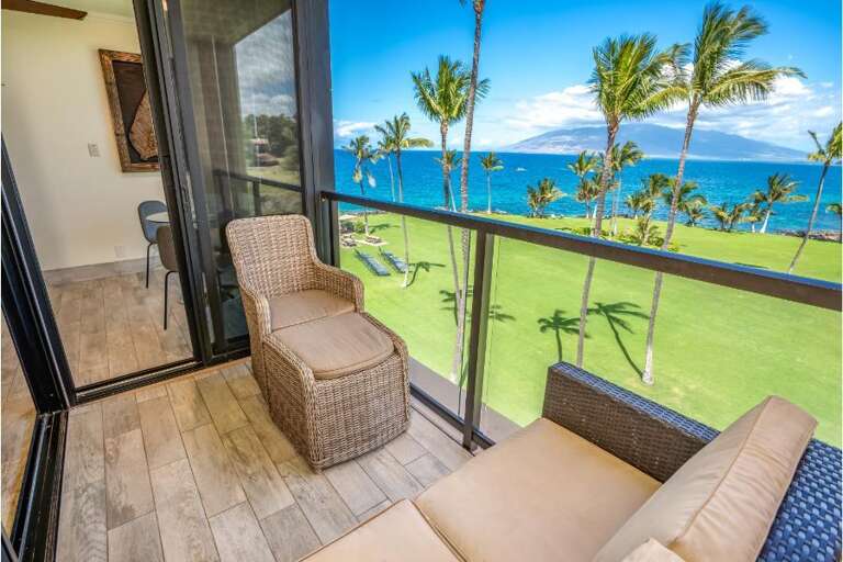 Balcony View Of Blue Sea And Green Grass With Palm Trees
