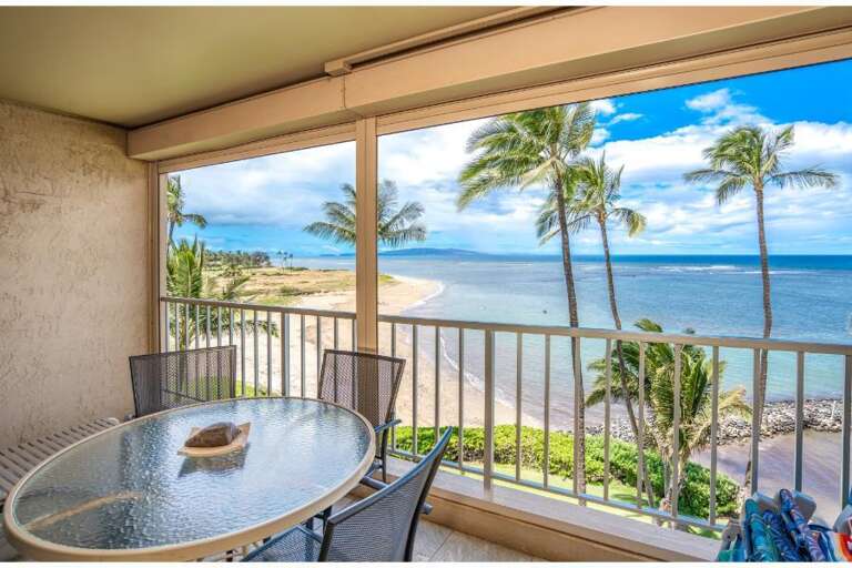 Balcony View Of Blue Beach And Bending Palms From Vacation Rental