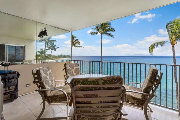 Balcony View Of Beach With Palm Trees From Vacation Rental