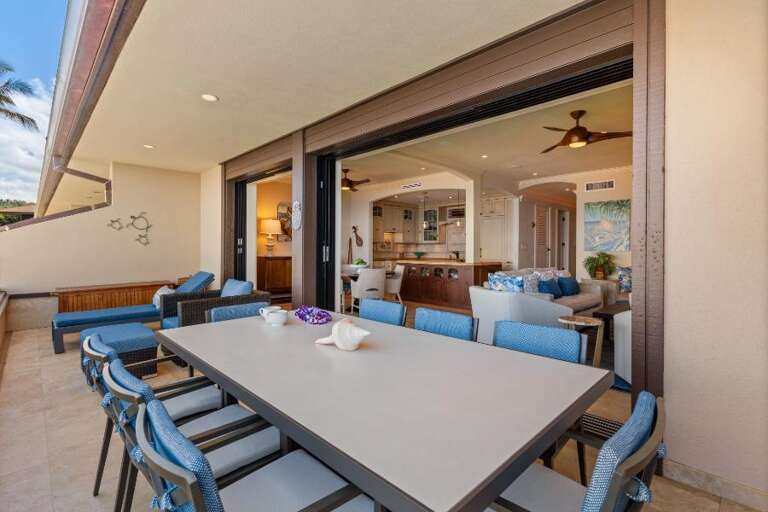 Spacious Dining Setup Leading Into Serene Living Area Of A Vacation Rental