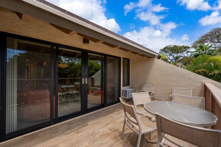 Vacation Rental Vista: Glass Doors, Deck Dining, Serene Skies