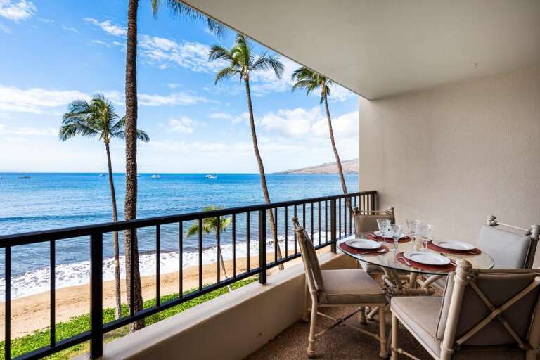 Balcony View Of Beach With Palm Trees, Dining Setup Overlooking The Ocean