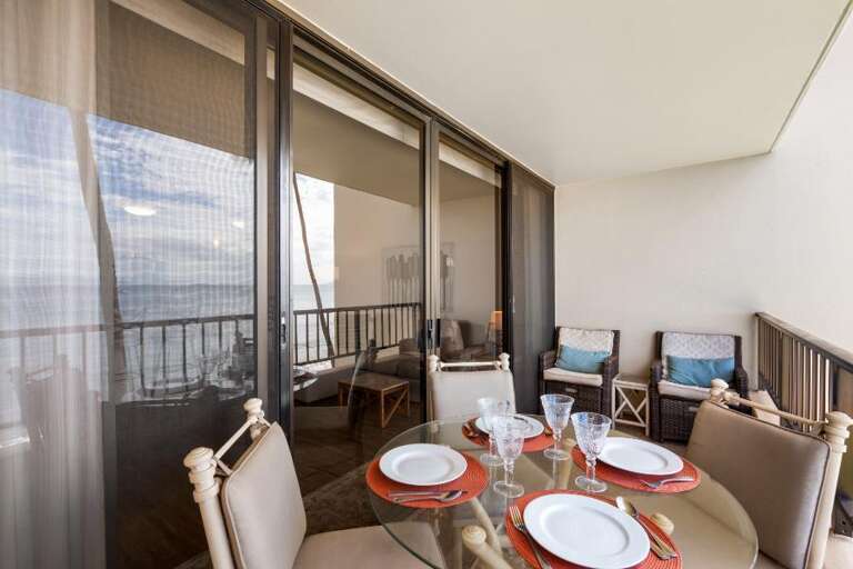 Balcony Breakfast Setting With Sliding Screen, Set Table, And Seating