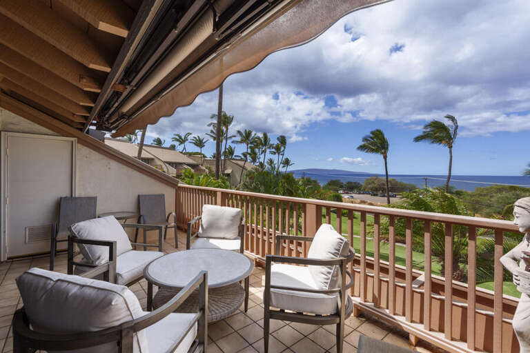 Balcony View With Breezy Palms And Blue Sky, Seating Set Up For Serene Scene