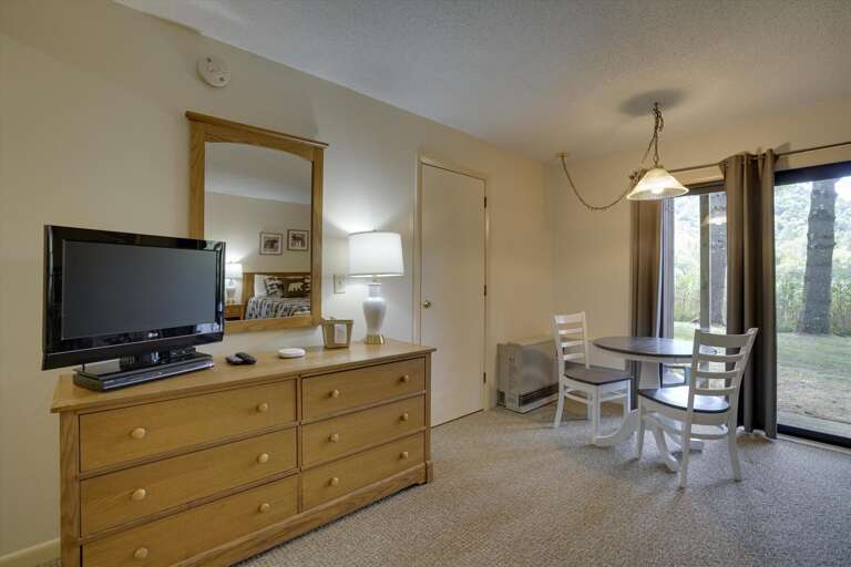 Watch the flat screen TV.