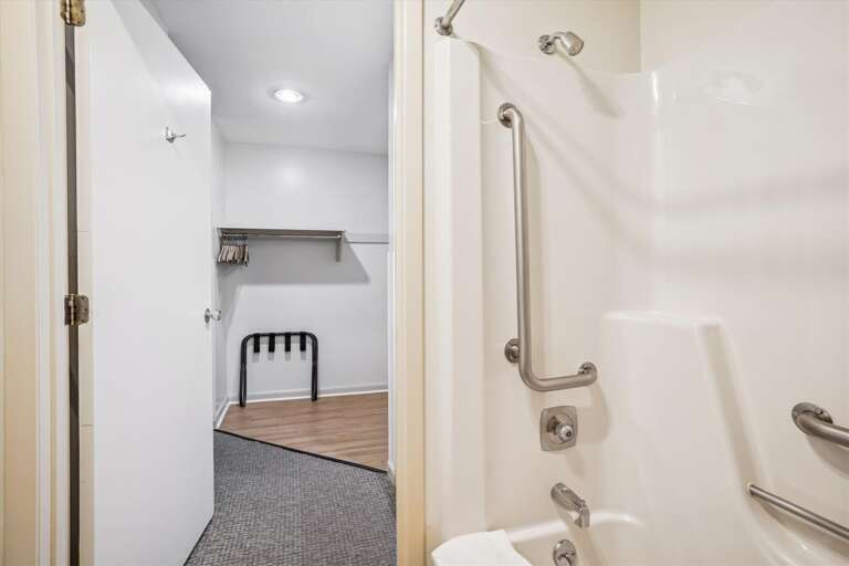 Full sized bathroom with a bathtub/shower combination.