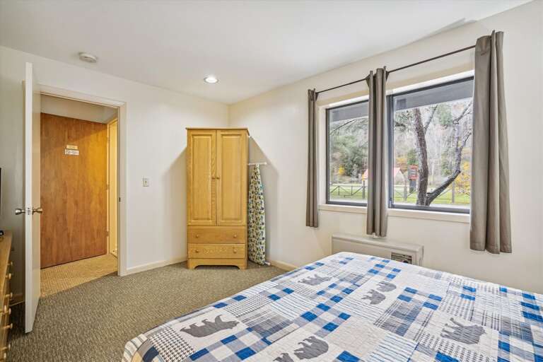 This bedroom has a lot of natural lighting.