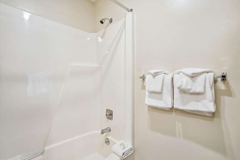 Well lit full bathroom.