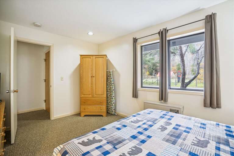 This bedroom has a lot of natural lighting.