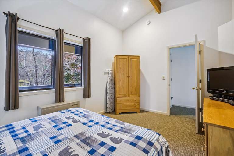 This bedroom has a lot of natural lighting.