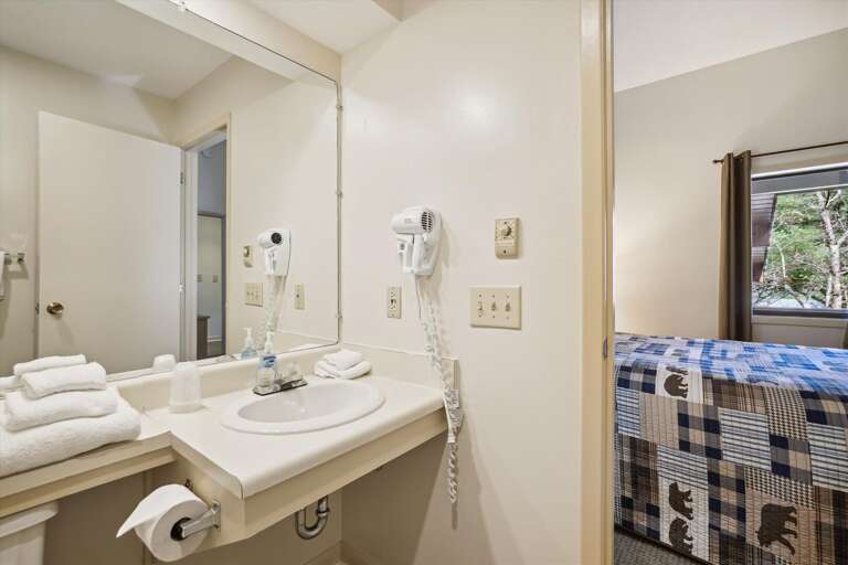 Full sized bathroom with a bathtub/shower combination.