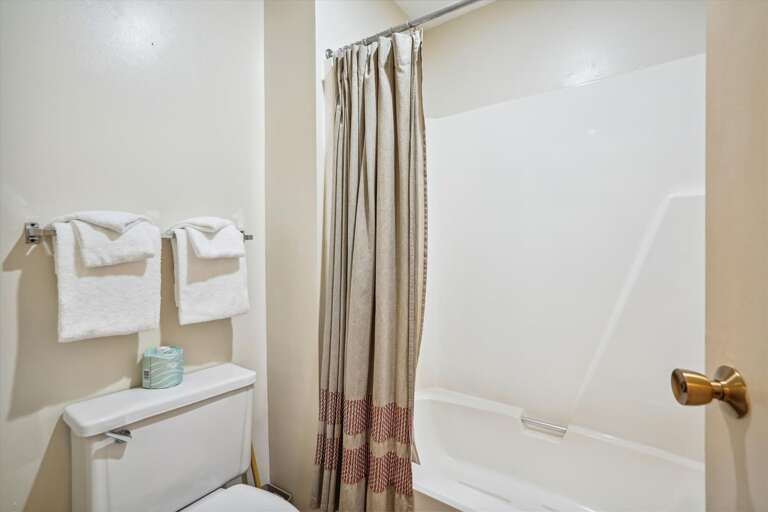 Full bathroom, with tub and shower combo Full bathroom, with tub and shower combo