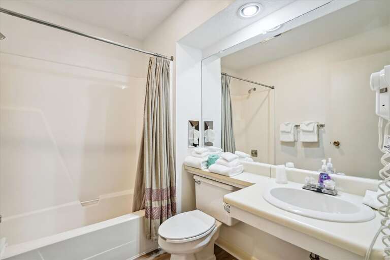 Full bathroom, with tub and shower combo