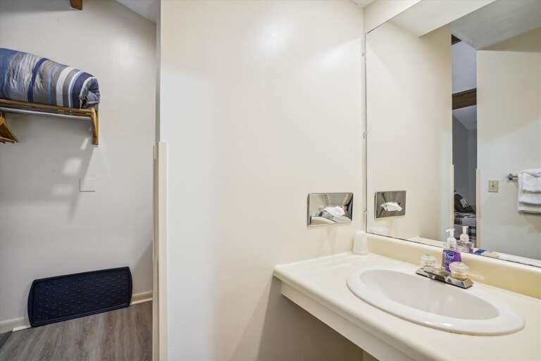 Full sized bathroom with a bathtub/shower combination.