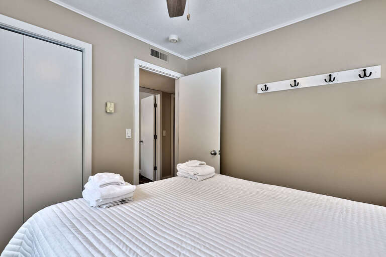 Queen bedroom.  Hooks and a closet provides plenty of storage space. Queen bedroom.  Hooks and a closet provides plenty of storage space.