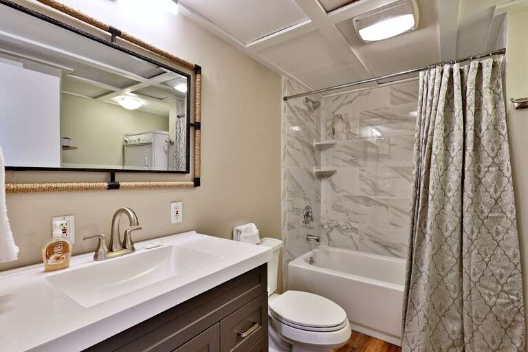 Shower/tub combo on the main floor living area. Shower/tub combo on the main floor living area.