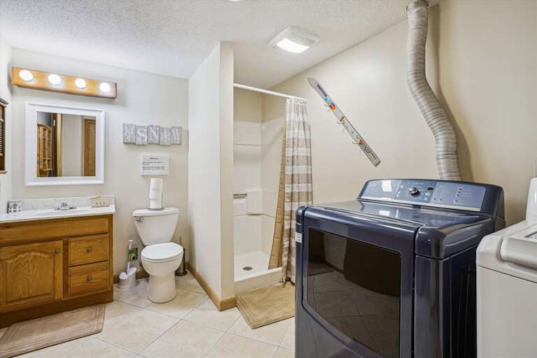 Bathroom with shower only, access to washer and dryer