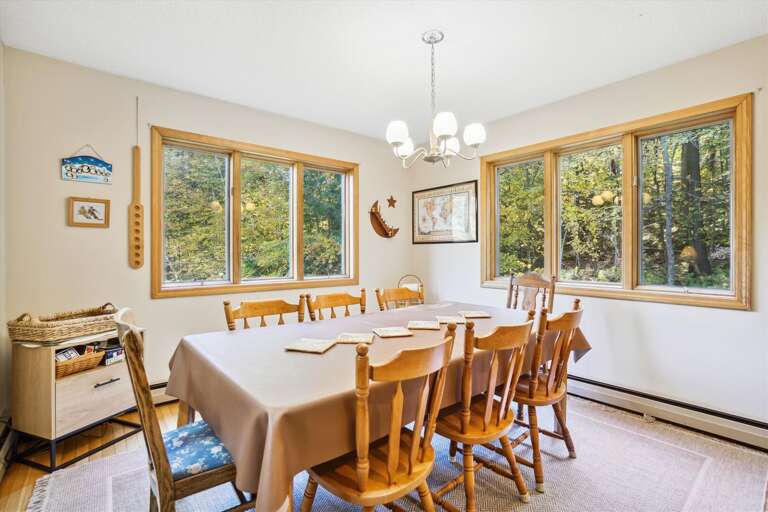 Dining table seats 8 comfortably, lots of natural light and large windows to enjoy the surrounding nature while have a home cooked meal.