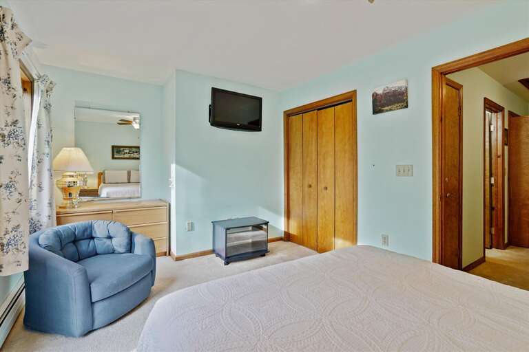 Lie in bed an enjoy the flat screen tv.