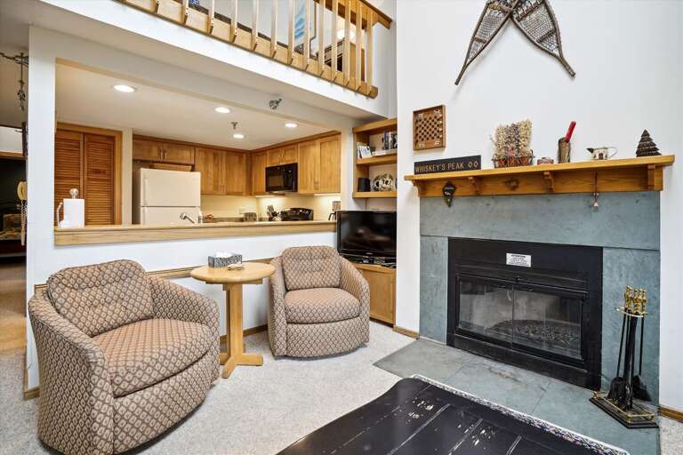 Lounge around the wood burning fireplace