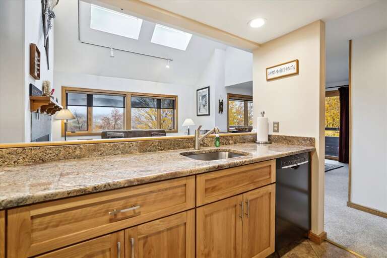 Modern upgraded kitchen.   Lots of counter space, great view to the living room and easy access to dining area while entertaining family and friends