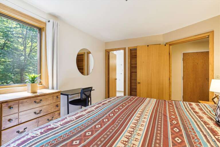 A small desk in this bedroom to use.