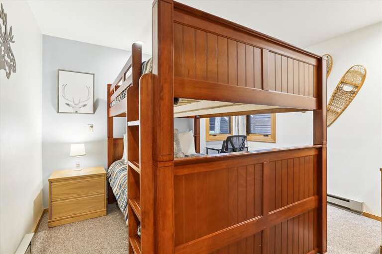 Spacious bedroom with queen bunk beds.