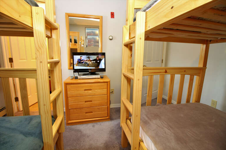 Bedroom with 2 bunk beds and flat-screen TV