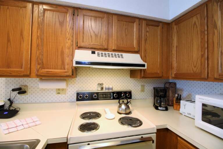 The kitchen has an electric stove perfect for all of your cooking needs