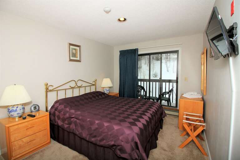 Lay down and enjoy watching the wall-mounted flat-screen TV