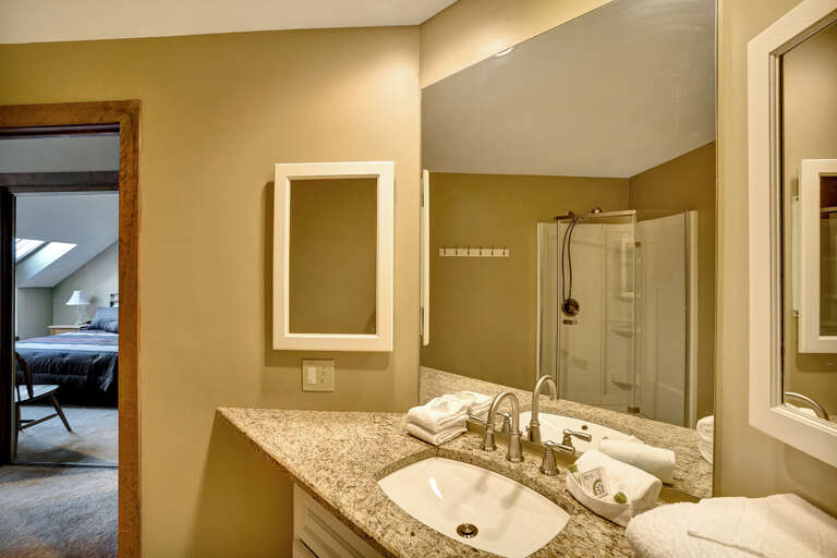 Bathroom with stand up shower attached to the master bedroom