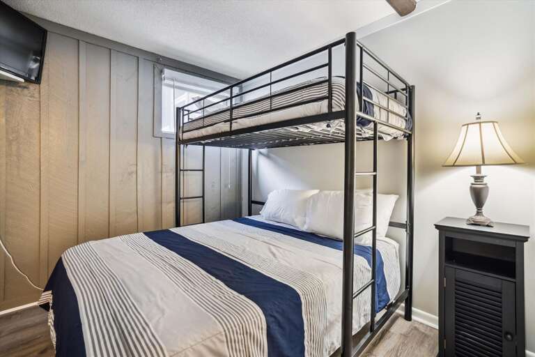 Queen bed on the bottom and a twin on top.