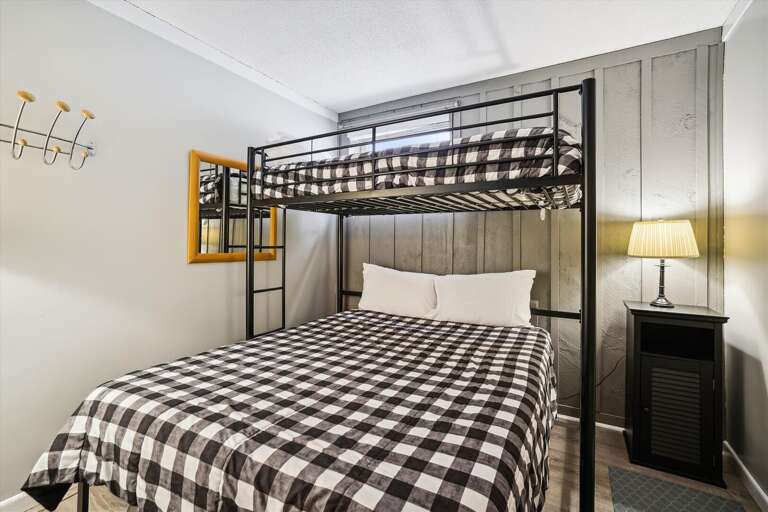 Queen bed on the bottom and a twin on top.