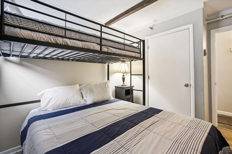 Queen bed on the bottom and a twin on top.