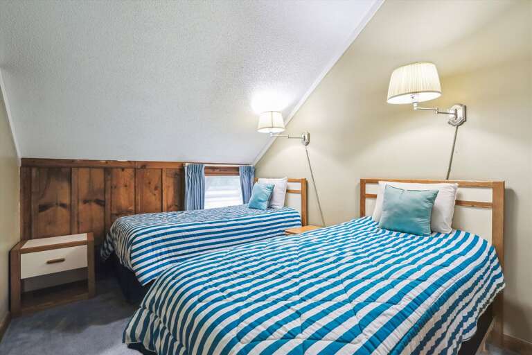 Twin bedroom located on second floor of unit