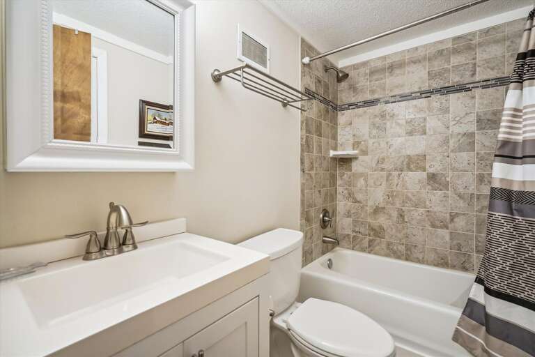 This bathroom has a tub/shower combo.