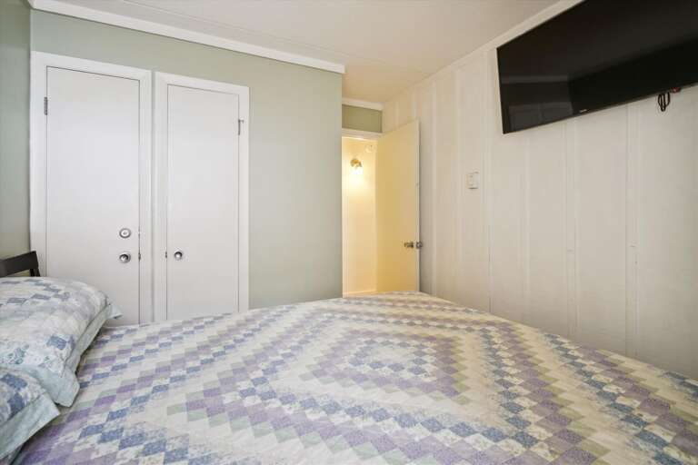 A flat screen tv in this bedroom!