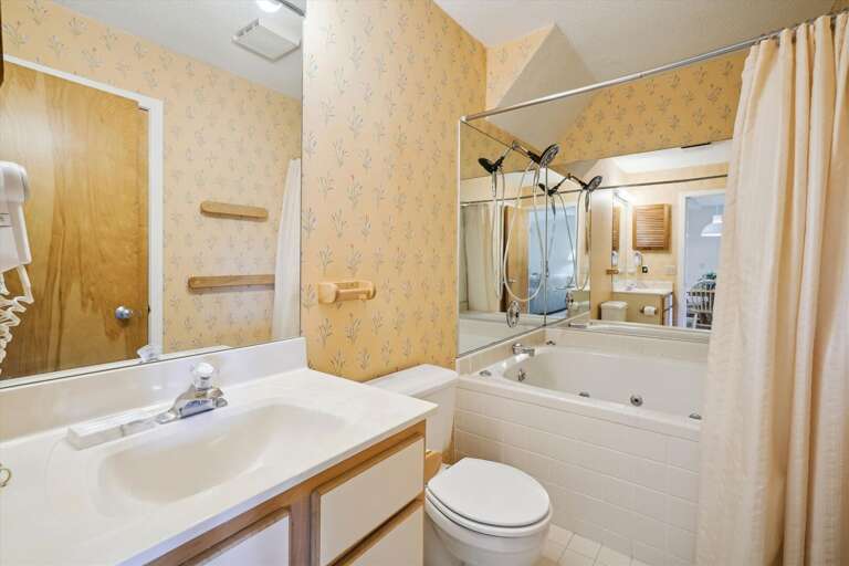 Full bathroom with a tub and shower.