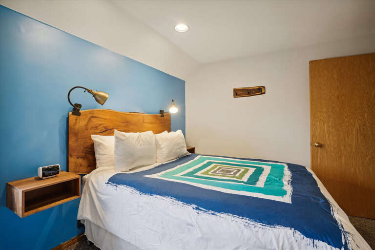 Bedroom with a queen bed on the main level.