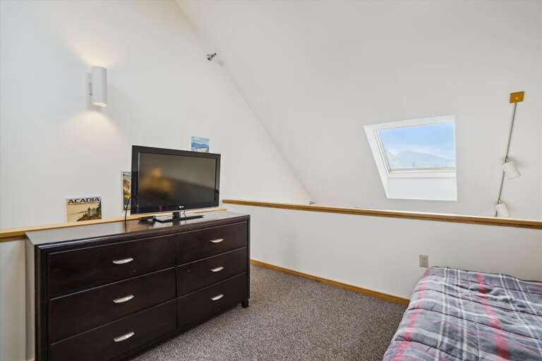 Watch a little TV before going to sleep. Loft with king bed.