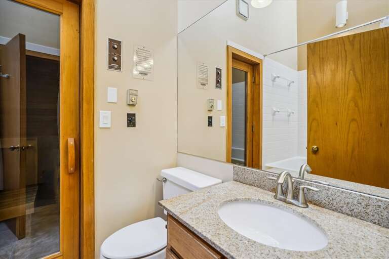 Full bathroom with Jetted bath tub and access to private sauna that seats 2 comfortably