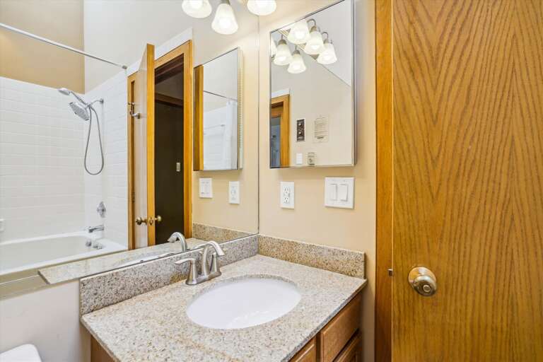Full bathroom with Jetted bath tub and access to private sauna that seats 2 comfortably
