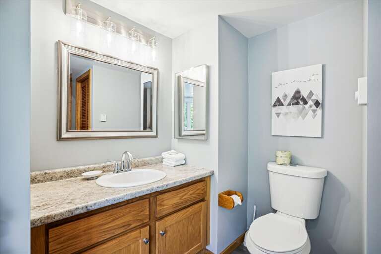 Brightly lit full bathroom. Brightly lit full bathroom.