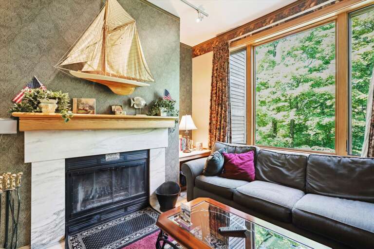Tastefully decorated living room. Enjoy the warm glow from the wood burning fireplace. Tastefully decorated living room. Enjoy the warm glow from the wood burning fireplace.