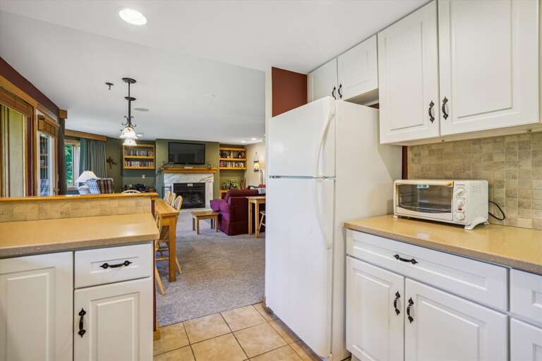 Take advantage of the open floor plan while cooking in  the updated bright kitchen!  Great to be able to visit with family and traveling companions and cook together.